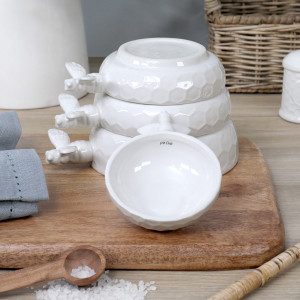 Set 4 Honeyfield White Bee Measuring Cups, a practical vessel for drinks with decorative tabletop appeal
