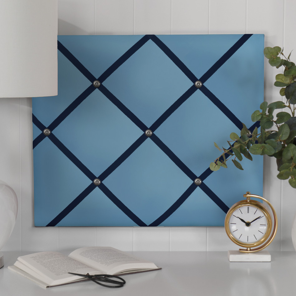 Bold blue fabric memo board shown with navy ribbon and antique nickel buttons