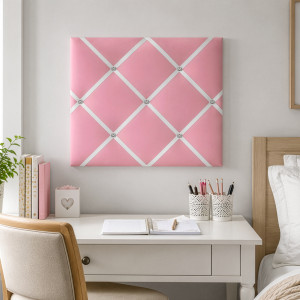 Fabric-covered pink wall organiser for photographs, invitations and reminders