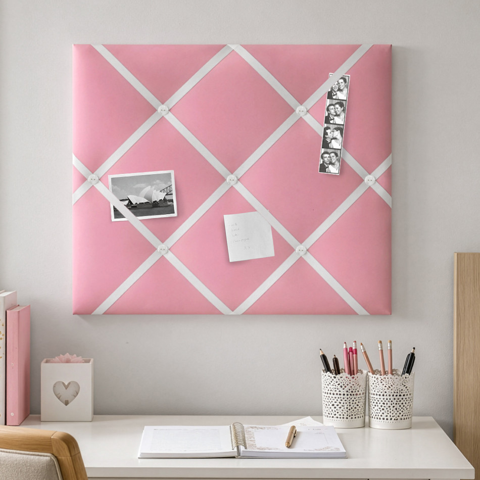 Candy-pink fabric memo board with white satin ribbon and white buttons