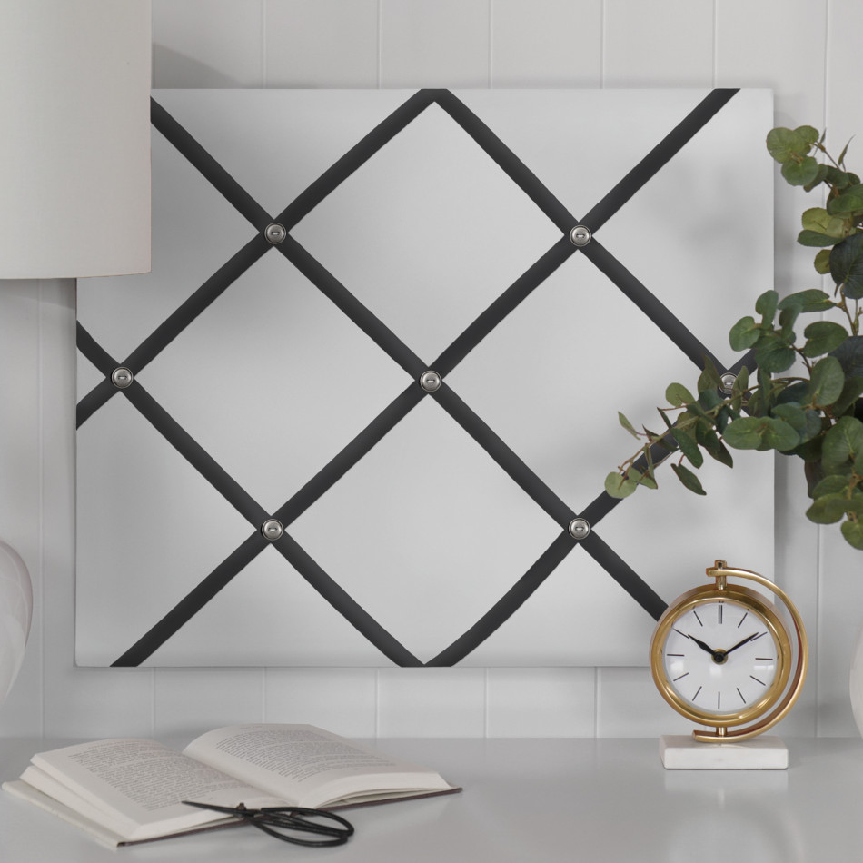 White fabric memo board with a charcoal ribbon grid and button detailing