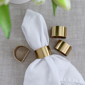 Set 4 Sorrento Gold Napkin Rings, a practical fabric accent for dressing and protecting a household surface