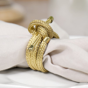 Set 4 Nova Gold Knot Napkin Rings, a textile accessory designed for dining, kitchen or tabletop use