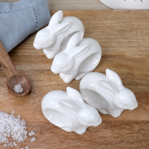Set 4 White Bunny Napkin Rings, a textile accent for dining or kitchen use
