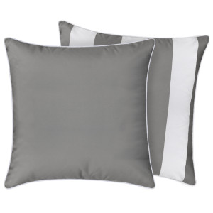 Grey outdoor cushion showing its neutral fabric and white piping with coordinating striped version