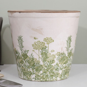 Close-up of the Glendale ceramic plant pot showing green botanical detail, a brown rim and vintage crackle glaze