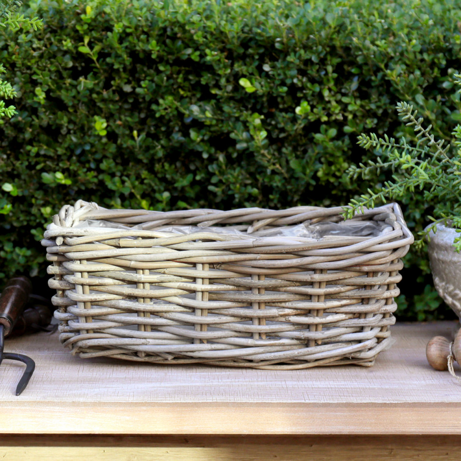 Small Amalfi Rectangle Rattan Planter Basket, a plant display piece suited to adding greenery to a styled space