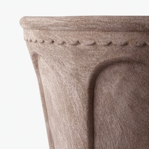 Close-up of the textured sand finish, rounded rim and scalloped arch detailing