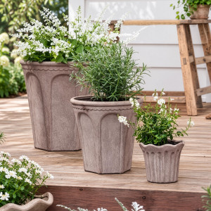 Varenna and Tivoli sand terracotta plant pots arranged in graduated sizes