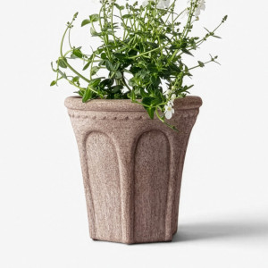 Front view of small sand terracotta Varenna plant pot filled with white flowers