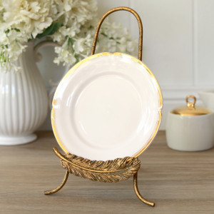 Golden Feather Plate Stand, a tabletop piece for serving or decorative display