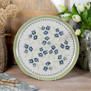 Round Isobel Blue Floral Serving Platter, a tabletop piece suited to serving food or creating a decorative display