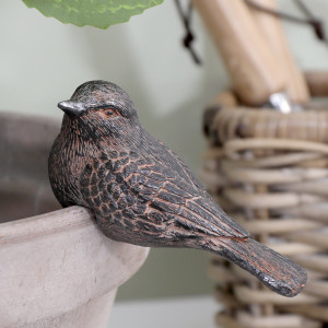 Close-up of Kendall Bird II vintage brown resin pot hanger showing layered wing feathers and a long tail