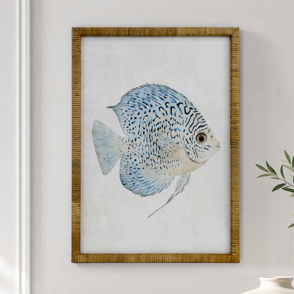 Close view of Coral Cove Fish I print with blue fins and dark markings in a golden rattan frame