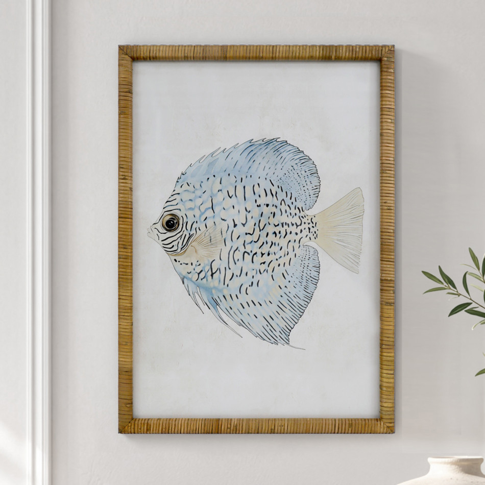 Coral Cove Fish II print featuring a pale blue fish in a natural rattan frame, styled beside leafy stems