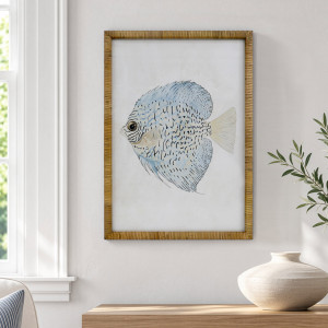 Coral Cove Fish II framed print beside a window above a timber console with a cream vase