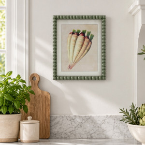 Cottage Garden Salsify print above a kitchen bench with potted herbs, a timber board and cream canister