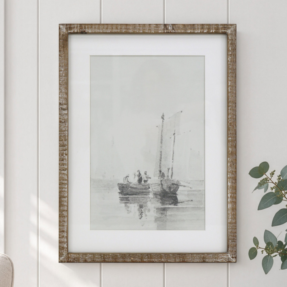 Falmouth Harbour I boat print in a rustic wood frame on a white panelled wall beside eucalyptus