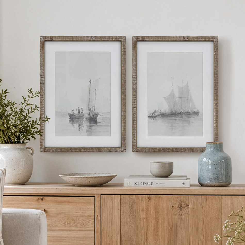 Falmouth Harbour I and II sailing boat prints in rustic wood frames above a timber sideboard with ceramic vases