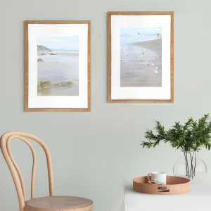 2 framed coastal prints from the Sandy Bay series displayed side by side