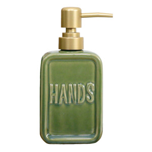 Close up of green ceramic 'Hands' soap dispenser on a white background
