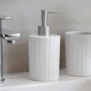 Soho White Soap Dispenser, highlighting the product's distinctive form and defining design