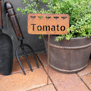 Rusty Tomato Garden Stake, highlighting the product's distinctive form and defining design