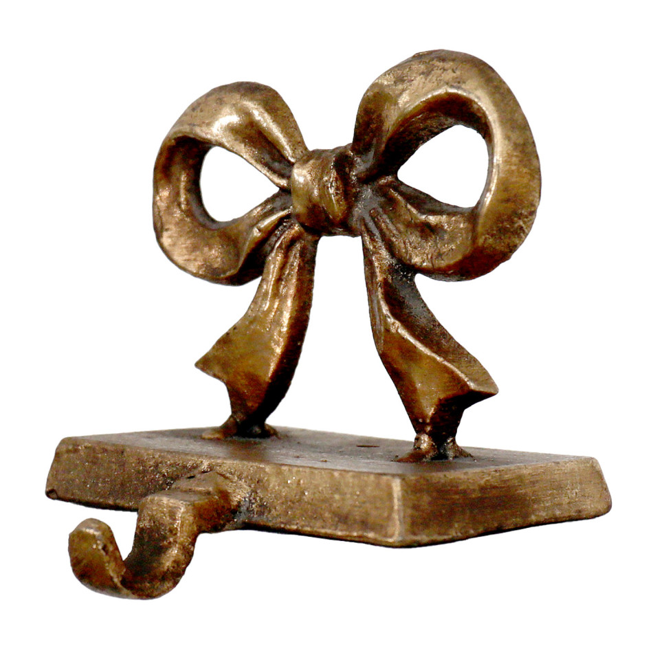 Angled view of Clara cast iron bow stocking hook showing its rectangular base and curved hook.