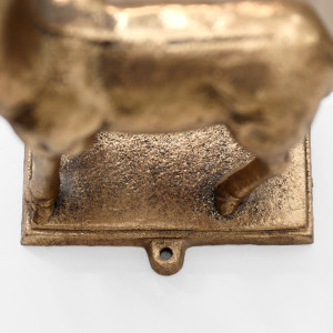 Close-up of the screw hole in the gold reindeer stocking hook base