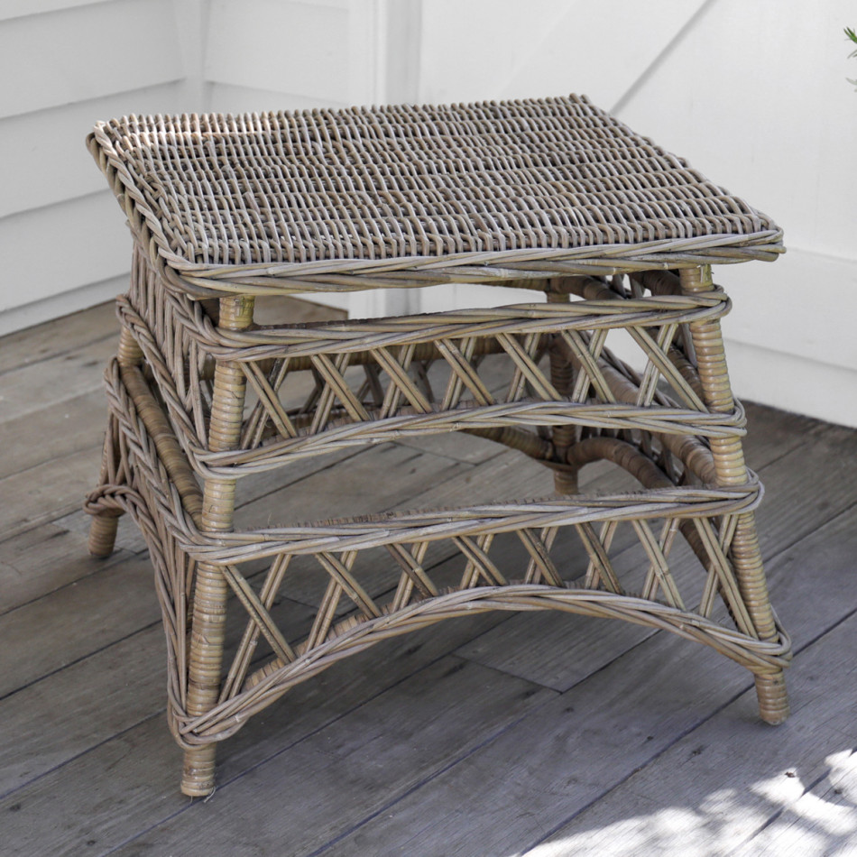 Freestanding Olympia rattan side table showing its square woven top and open lattice frame