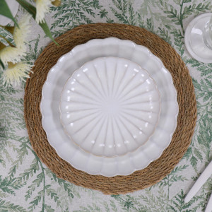 Round Verdilla tablecloth styled underneath a dinner placement