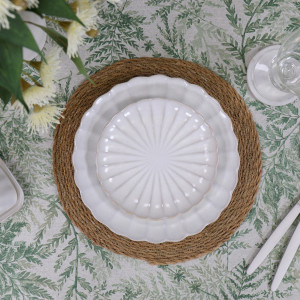Round Verdilla tablecloth showing from underneath a dinner setting