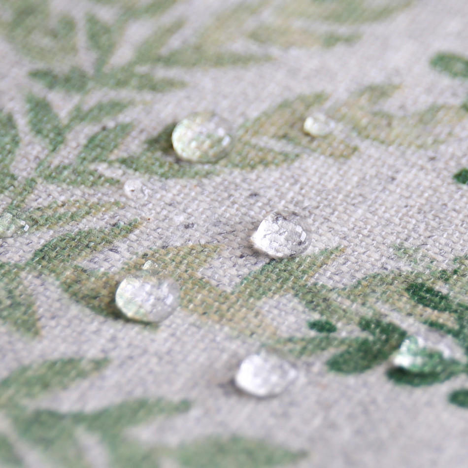 Close view of the protective layered green foliage pattern on the tablecloth