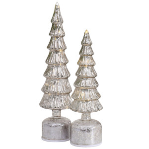 Small Wonderland silver Christmas tree beside the coordinating large tree, both illuminated against a white background