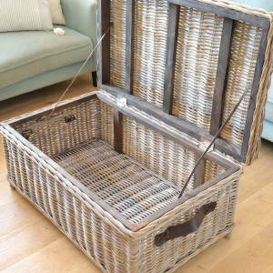Open Hartley rattan trunk showing its spacious storage interior and hinged lid