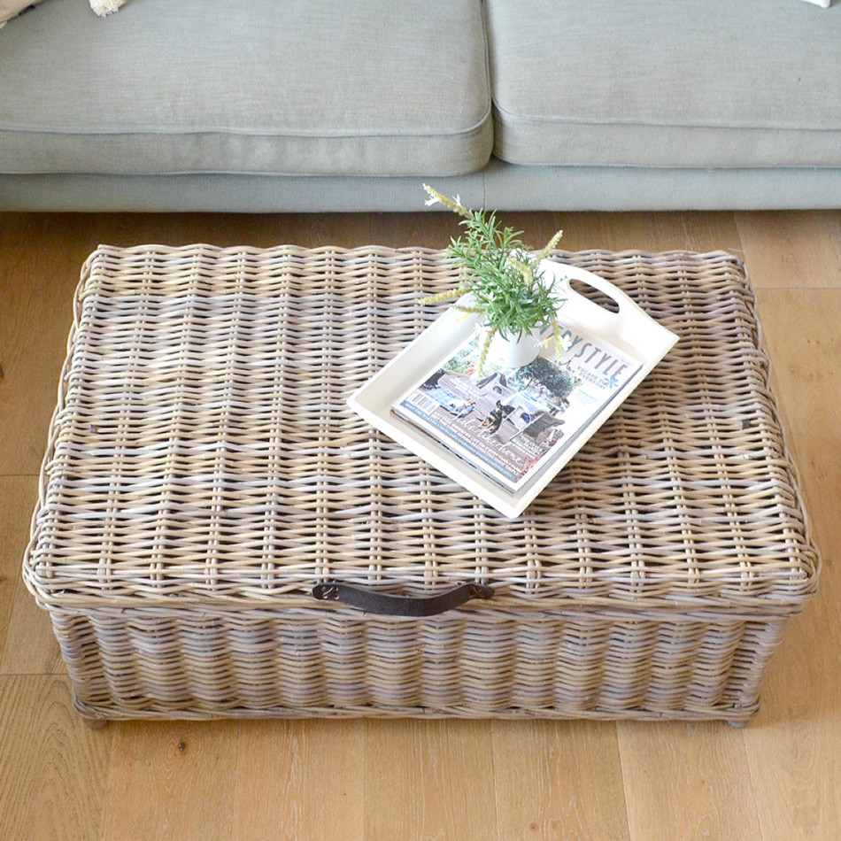 Elevated view of the Hartley rattan trunk’s woven lid styled with a magazine
