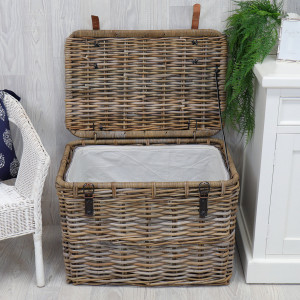 Open Rochester rattan storage trunk showing its removable cream cotton lining