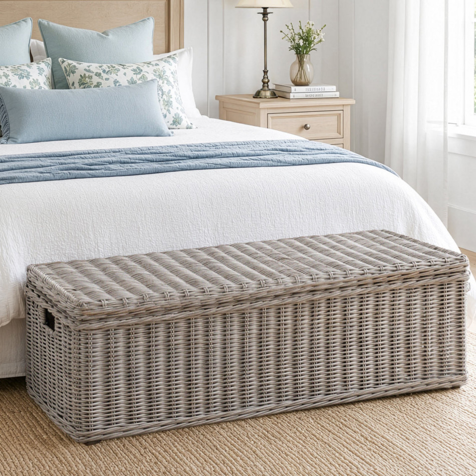 St Alban long greywash rattan trunk at the foot of a bed
