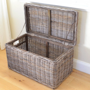 Oliver rattan blanket box with its hinged lid open to show the storage compartment