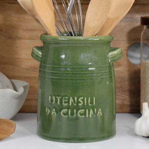 Close up of green glazed ceramic utensil holder with side handles and Italian lettering.