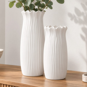 Tall and small Marissa white fluted ceramic vases on a timber console, with eucalyptus stems in the tall vase