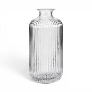 Empty tall clear glass vase with vertical ribbing, rounded shoulders and a flared rim