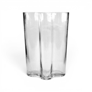 Front view of the empty clear glass vase with a wide opening and sculptural profile