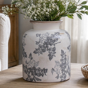 Short Norwood grey floral ceramic vase filled with white flowers and greenery on a timber table