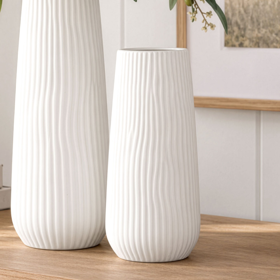 Short Zahra ribbed white ceramic vase beside the taller matching vase on a timber console