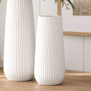 Short Zahra ribbed white ceramic vase beside the taller matching vase on a timber console