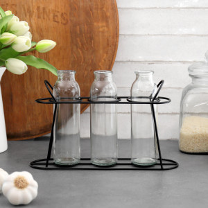 Set 3 Lucent Bottles in Black Stand, a drinkware piece designed for serving beverages at the table
